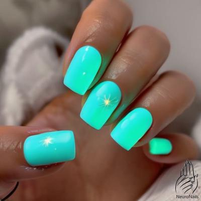 Turquoise neon nails with a starburst flare
